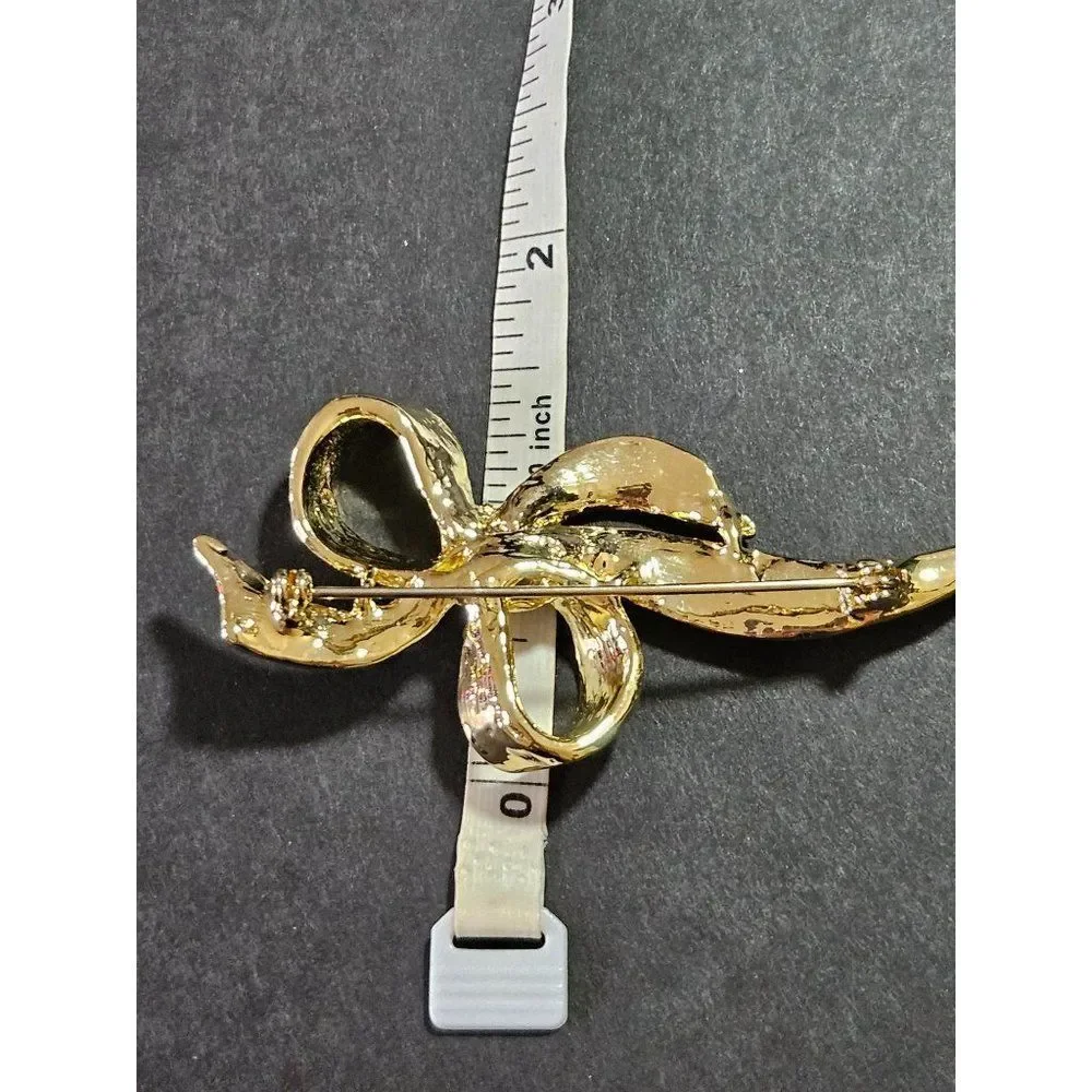 Vintage gold tone blue enamel bow brooch